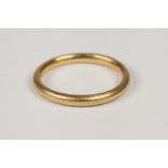GOLD COLOURED METAL PLAIN ROUND SECTION WEDDING RING, 4.9gms