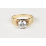 18ct GOLD BARK TEXTURED RING, claw set with a solitaire white stone, 5gms, ring size 'N/O'