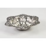 EMBOSSED STERLING SILVER DISH, of steep sided shaped hexagonal form, with petal shaped centre,