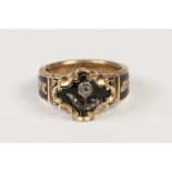 GEORGE VI GOLD (unmarked) AND BLACK ENAMELLED MEMORIAL RING, the quatrefoil enamelled top overlaid