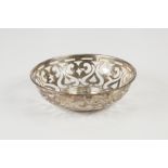 EDWARD VII PIERCED SILVER BON BON DISH, of steep sided, footed form, decorated with stylised