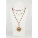 LONG 9ct GOLD GUARD CHAIN with clip, 56" long and the 9ct gold large circular SHELL PATTERN PENDANT,