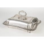 EDWARDIAN SILVER ENTREE DISH of waisted oblong shape with gadrooned edge and border to the cover,