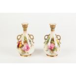 PAIR OF EARLY TWENTIETH CENTURY HAND PAINTED ROYAL WORCESTER TWO HANDLED BLUSH CHINA VASES, each