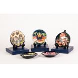 FIVE BOXED MODERN MOORCROFT TUBE LINED POTTERY SMALL SAUCER DISHES, various patterns, LAMIA,