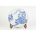 A JAPANESE LATE MEIJI PERIOD PORCELAIN WALL PLAQUE, transfer printed in underglaze blue with two