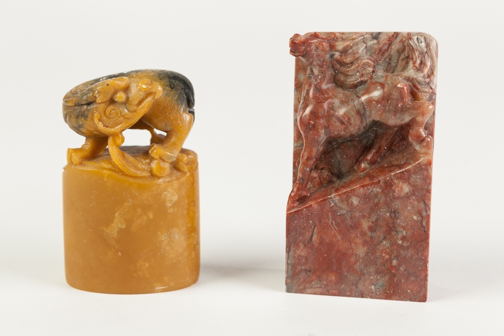 A CHINESE SOAPSTONE SQUARE SEAL, carved with a chilong, 2 1/2" (6.5cm) high, AND ANOTHER of