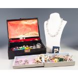 BLACK JEWELLERY BOX WITH MISCELLANEOUS TRINKETS and various boxed COSTUME JEWELLERY including a