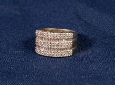 9ct GOLD AND DIAMOND HALF HOOP RING, in the form of three conjoined rings, each with a two row