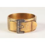 VICTORIAN GOLD COLOURED METAL HINGE OPENING BUCKLE BANGLE, 'buckle' top set with twenty three rose