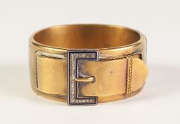 VICTORIAN GOLD COLOURED METAL HINGE OPENING BUCKLE BANGLE, 'buckle' top set with twenty three rose