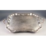 20th CENTURY ELECTROPLATE SHAPED-OBLONG TWO HANDLED TEA TRAY, 27 1/2" (70cm) long across handles