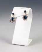 PAIR OF SAPPHIRE AND DIAMOND CLUSTER DROP EARRINGS, each with a claw set small oval sapphire and