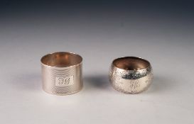 TWO SILVER NAPKIN RINGS, one engine turned, Sheffield 1935, the other floral engraved, Sheffield