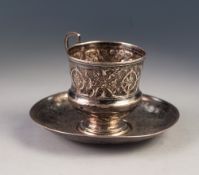 19th CENTURY RUSSIAN SILVER COLOURED METAL CUP with raised 'S' scroll handle, the campana shaped