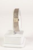 9ct WHITE GOLD LADY'S BUECHE-GIROD WRIST WATCH, the tiny square dial within uniformly textured