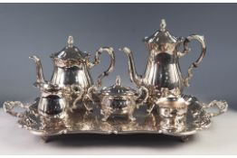 FOUR PIECE ELECTROPLATED TEA AND COFFEE SET, of baluster form with ornate scroll handles and