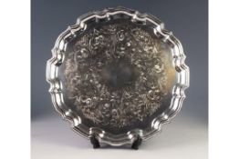 MODERN CHIPPENDALE STYLE ELECTROPLATED TRAY, of circular form with wavy outline and foliate scroll