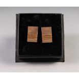 PAIR OF 9ct GOLD 'T' BAR CUFF LINKS, the textured oblong tops having ladder cross bars to one end,