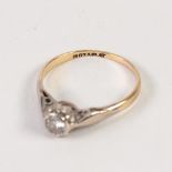 18ct GOLD AND PLATINUM RING, with a solitaire diamond in a rubbed setting, approx .20ct, 2gms,