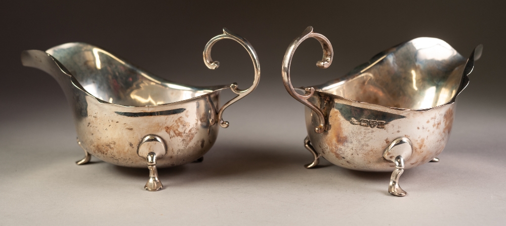 PAIR OF INTER-WAR YEARS SILVER SAUCE BOATS with cut rims and flying scroll handles, each standing on - Image 3 of 4