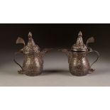 PAIR OF SMALL OTTOMAN STYLE 800 PURITY SILVER INDIVIDUAL COFFEE POTS, chased autour with foliate