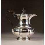 EARLY 20th CENTURY SILVER COFFEE POT of baluster shape with pierced scrolliated rim, blackwood