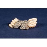 FINE STRAND SIMULATED PEARL AND WHITE METAL MARCASITE SET CLASPED BRACELET