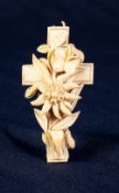 NINETEENTH CENTURY EUROPEAN CARVED IVORY CROSS PENDANT, with an Edelweiss in free relief, 2 3/4"