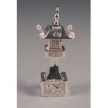 CHINESE STERLING SILVER PAGODA PATTERN PEPPERETTE, with sliding panel to the base, 3 ¼" (8.3cm)