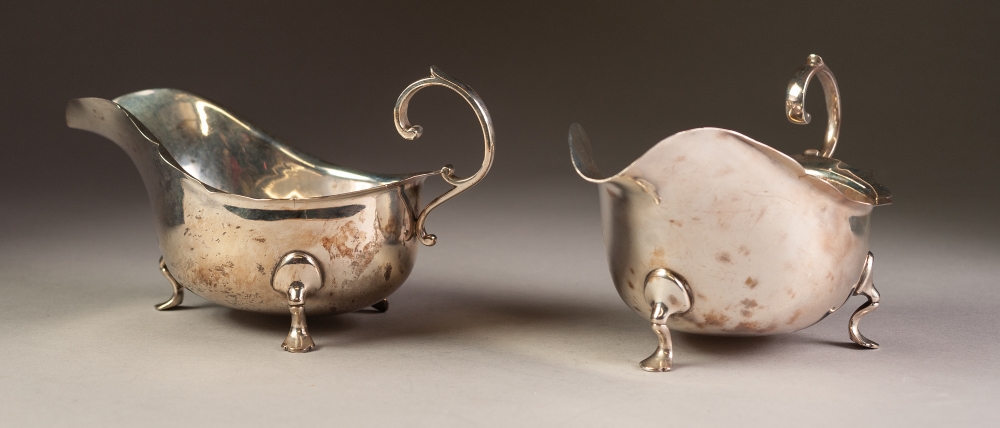 PAIR OF INTER-WAR YEARS SILVER SAUCE BOATS with cut rims and flying scroll handles, each standing on - Image 2 of 4