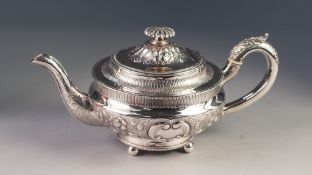 GEORGE III IRISH SILVER TEAPOT, repousse decorated with flowering, scrolling foliage and two