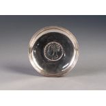 FOREIGN SILVER COLOURED METAL SMALL DISH WITH ONE RUPEE COIN TO THE BASE, 3" (7.6cm) diameter,