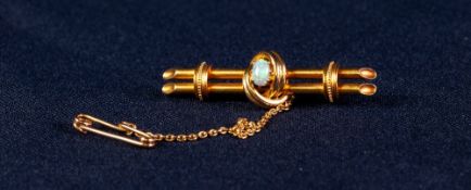 EDWARDIAN 15ct GOLD BROOCH centrally set with an opal, with safety chain, 5.1 gms gross, in case