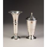 AN ART DECO SILVER SUGAR CASTOR, lined in cream thermo plastic with screw on perforated cover,