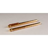 A MATCHED PAIR OF MODERN CARTIER (PARIS) GOLD PLATED FOUNTAIN AND BALLPOINT PENS, serial numbers