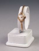 LADY'S 'TALIS' 9ct GOLD WRIST WATCH, with mechanical movement, lozenge shaped silver dial with