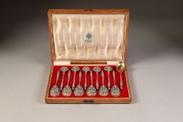 EARLY 1900s RUSSIAN OAK CASED SET OF TWELVE SILVER-GILT AND CLOISONNE ENAMEL SPOONS, 88 zolotniks