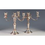 PAIR OF SILVER PLATED ON COPPER THREE LIGHT TABLE CANDLESTICKS, each with urn shaped sconces, two