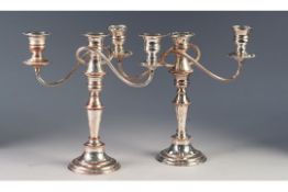 PAIR OF SILVER PLATED ON COPPER THREE LIGHT TABLE CANDLESTICKS, each with urn shaped sconces, two