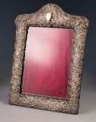 SILVER MOUNTED PHOTOGRAPH FRAME WITH EASEL SUPPORT, pierced and embossed with C scrolls and