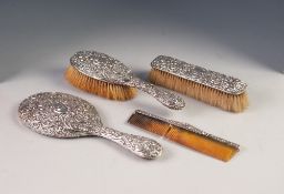 LATE VICTORIAN FOUR PIECE EMBOSSED SILVER BACKED HAND MIRROR AND BRUSH SET, Birmingham 1900, hand