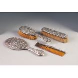 LATE VICTORIAN FOUR PIECE EMBOSSED SILVER BACKED HAND MIRROR AND BRUSH SET, Birmingham 1900, hand