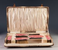 LADY'S ART DECO SILVER AND PINK GUILLOCHE 'SUNBURST' PATTERN ENAMELLED DRESSING TABLE BRUSH SET OF