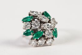 18ct WHITE GOLD, DIAMOND AND EMERALD COCKTAIL RING, set with six round brilliant cut diamonds,