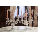 A PAIR OF CUT GLASS THREE BRANCH TABLE CANDELABRA WITH BEADED FESTOONS AND FACETED GLASS TEAR SHAPED