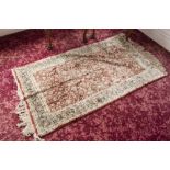 EASTERN PART SILK RUG WITH ALL-OVER HERATI FLORAL DESIGN, ON RED FIELD, TRIPLE BORDER STRIPES, 5'