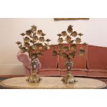 A PAIR OF GILT METAL FIVE LIGHT CANDELABRA, IN THE FORM OF URNS OF FLOWERS, THE FLOWERS HAVING