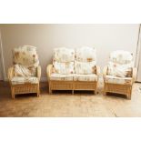 BAMBOO AND CANE CONSERVATORY WINGED THREE PIECE SUITE COMPRISING A TWO SEATER SETTEE AND A PAIR OF
