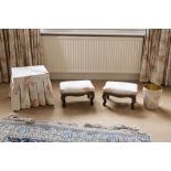 A PAIR OF VICTORIAN STYLE CARVED MAHOGANY OBLONG FOOTSTOOLS UPHOLSTERED AND COVERED IN CREAM AND